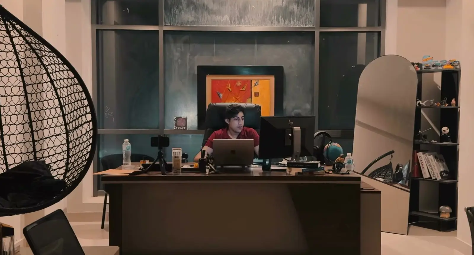 A desk in the Drifted studio at night, lit by the monitor, from the studio's film.